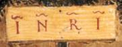 The letters INRI commonly found on crosses